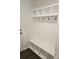Well-organized mudroom with custom shelves, hooks, and bench, offering functional storage solutions at 8231 Annsborough Nw Dr, Concord, NC 28027
