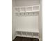 Convenient mudroom with custom built-ins, including cubbies, hooks, bench, and storage, perfect for organization at 8231 Annsborough Nw Dr, Concord, NC 28027