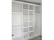 Custom walk-in closet featuring a modular storage system, with open shelving and carpet at 8231 Annsborough Nw Dr, Concord, NC 28027