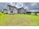 Large backyard with green grass, playground equipment, trampoline, and a view of other homes at 972 Von Buren Blvd # 242, Rock Hill, SC 29730