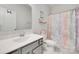 Bright bathroom featuring a gray vanity, toilet and tub with a unicorn shower curtain at 972 Von Buren Blvd # 242, Rock Hill, SC 29730