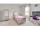 Bright bedroom decorated with a bed, a TV, a vanity table, and a large window at 972 Von Buren Blvd # 242, Rock Hill, SC 29730