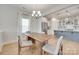 Bright dining area with modern chandelier and seamless transition to the adjacent kitchen at 972 Von Buren Blvd # 242, Rock Hill, SC 29730