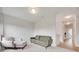 Well-lit living room with green sofa, accent chair, and neutral carpet at 972 Von Buren Blvd # 242, Rock Hill, SC 29730