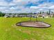 Neighborhood playground with a swing set and climbing equipment surrounded by green grass and community homes on a beautiful day at 972 Von Buren Blvd # 242, Rock Hill, SC 29730