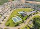 Aerial view of a community with a pool, tennis courts, and a clubhouse at 10180 Lakeshore Dr, Lancaster, SC 29720