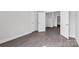 Hallway showcasing hardwood floors, white trim, and multiple doorways at 10180 Lakeshore Dr, Lancaster, SC 29720