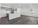 Bright kitchen with white countertops, gray cabinets, hardwood flooring, and modern stainless steel appliances at 10180 Lakeshore Dr, Lancaster, SC 29720