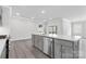 Kitchen includes a gray island, stainless appliances, and lots of natural light at 10180 Lakeshore Dr, Lancaster, SC 29720