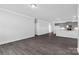 Inviting living room featuring hardwood floors, recessed lights, and easy access to the kitchen area at 10180 Lakeshore Dr, Lancaster, SC 29720