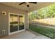 Screened-in patio with sliding glass door and view of the wooded backyard at 10180 Lakeshore Dr, Lancaster, SC 29720