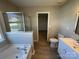Bathroom features a soaking tub, glass enclosed shower and a white vanity at 107 Ameena Chase Trl, Mooresville, NC 28117