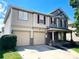 Charming two-story home featuring a two-car garage and inviting front porch at 107 Ameena Chase Trl, Mooresville, NC 28117