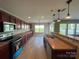 Modern kitchen with sleek appliances, ample counter space, and generous cabinet storage at 107 Ameena Chase Trl, Mooresville, NC 28117