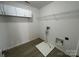 Laundry room with overhead storage cabinets and hookups for a washer and dryer at 107 Ameena Chase Trl, Mooresville, NC 28117