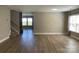 Spacious living room featuring modern flooring and a staircase at 107 Ameena Chase Trl, Mooresville, NC 28117