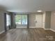 Bright living room with new floors and large windows at 107 Ameena Chase Trl, Mooresville, NC 28117