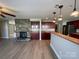 Open concept living room with a stone fireplace and access to the kitchen at 107 Ameena Chase Trl, Mooresville, NC 28117