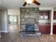 Elegant stone fireplace is the focus of this living room with wood floors at 107 Ameena Chase Trl, Mooresville, NC 28117