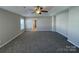 Spacious main bedroom with neutral paint, carpet, and a ceiling fan at 107 Ameena Chase Trl, Mooresville, NC 28117