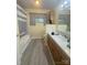 Well-lit bathroom featuring a sleek vanity, a combination tub and shower, and contemporary fixtures at 1107 Crestfield Dr, Lancaster, SC 29720