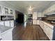 Spacious kitchen featuring white cabinetry, modern appliances, and hardwood floors for a classic look at 1107 Crestfield Dr, Lancaster, SC 29720