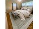 Inviting bedroom featuring wood floors, a comfortable bed, and contemporary decor for a relaxing atmosphere at 1107 Crestfield Dr, Lancaster, SC 29720