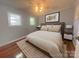 Cozy bedroom with hardwood floors, neutral decor, and ample natural light creating a serene retreat at 1107 Crestfield Dr, Lancaster, SC 29720