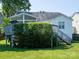 Exterior view of the back of the house shows the deck and sunroom with stairs to the yard at 11911 Brownestone View Dr, Charlotte, NC 28269