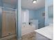 Bathroom featuring a separate shower, bathtub, and sink with countertop at 11911 Brownestone View Dr, Charlotte, NC 28269