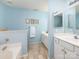 Bathroom featuring double sinks, a bathtub, and modern fixtures at 11911 Brownestone View Dr, Charlotte, NC 28269