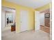 Neutral bedroom featuring carpeted floors and multiple doors at 11911 Brownestone View Dr, Charlotte, NC 28269