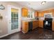 Bright kitchen featuring stainless steel appliances, wood cabinets, and access to the porch at 11911 Brownestone View Dr, Charlotte, NC 28269