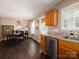 Kitchen with stainless steel appliances, granite countertops, and a dining area at 11911 Brownestone View Dr, Charlotte, NC 28269