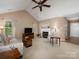 Inviting living room with vaulted ceilings, a fireplace, and comfortable seating at 11911 Brownestone View Dr, Charlotte, NC 28269