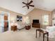 Spacious living room with vaulted ceilings, a ceiling fan, and ample seating at 11911 Brownestone View Dr, Charlotte, NC 28269