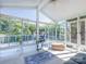 Bright sunroom with many windows and a ceiling fan provides great natural light and views at 11911 Brownestone View Dr, Charlotte, NC 28269