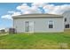 The house features a well-maintained backyard with green grass and clean siding at 120 Parson Ln, Statesville, NC 28625