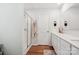 Bathroom featuring double sinks, white cabinets, quartz countertop, and a glass-enclosed shower at 120 Parson Ln, Statesville, NC 28625