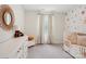 Bedroom with a crib and dresser with mirror creates a cozy and inviting space at 120 Parson Ln, Statesville, NC 28625