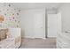 Bedroom with a crib and dresser creates a cozy and inviting space at 120 Parson Ln, Statesville, NC 28625