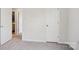 Bedroom featuring neutral walls, grey carpet, and a doorway leading to another room at 120 Parson Ln, Statesville, NC 28625