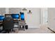 Home office features an ergonomic chair, a multi monitor setup, and a sleek aesthetic at 120 Parson Ln, Statesville, NC 28625