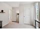 Bright bedroom shows neutral walls and carpet with 2 doors leading to other rooms at 120 Parson Ln, Statesville, NC 28625