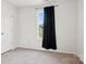Bedroom featuring black curtains and a bright window with an exterior view at 120 Parson Ln, Statesville, NC 28625