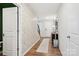 Hallway featuring an area rug, coat rack, and patterned wallpaper leading towards a staircase at 120 Parson Ln, Statesville, NC 28625