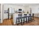 Bright kitchen with stainless steel appliances, quartz countertops, and black chairs at a breakfast bar at 120 Parson Ln, Statesville, NC 28625
