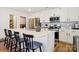 Bright kitchen with stainless steel appliances, quartz countertops, and island with breakfast bar at 120 Parson Ln, Statesville, NC 28625
