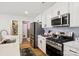 Kitchen with stainless steel appliances, quartz countertops, and a walk-in pantry at 120 Parson Ln, Statesville, NC 28625