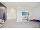 Carpeted living room featuring a TV and play area, perfect for relaxation and entertainment at 120 Parson Ln, Statesville, NC 28625